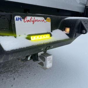 Baja Built - License plate amber bar shown on a white Tacoma
